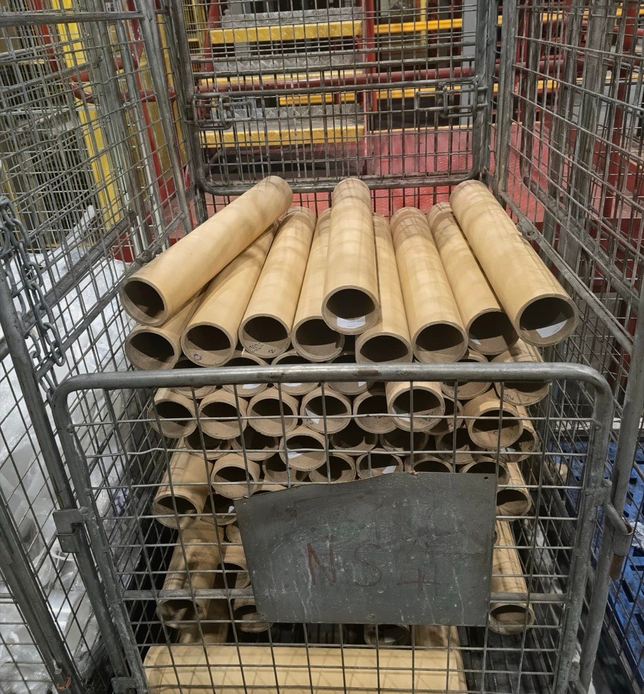 Recovered kraft cores in a stillage, ready to be reused