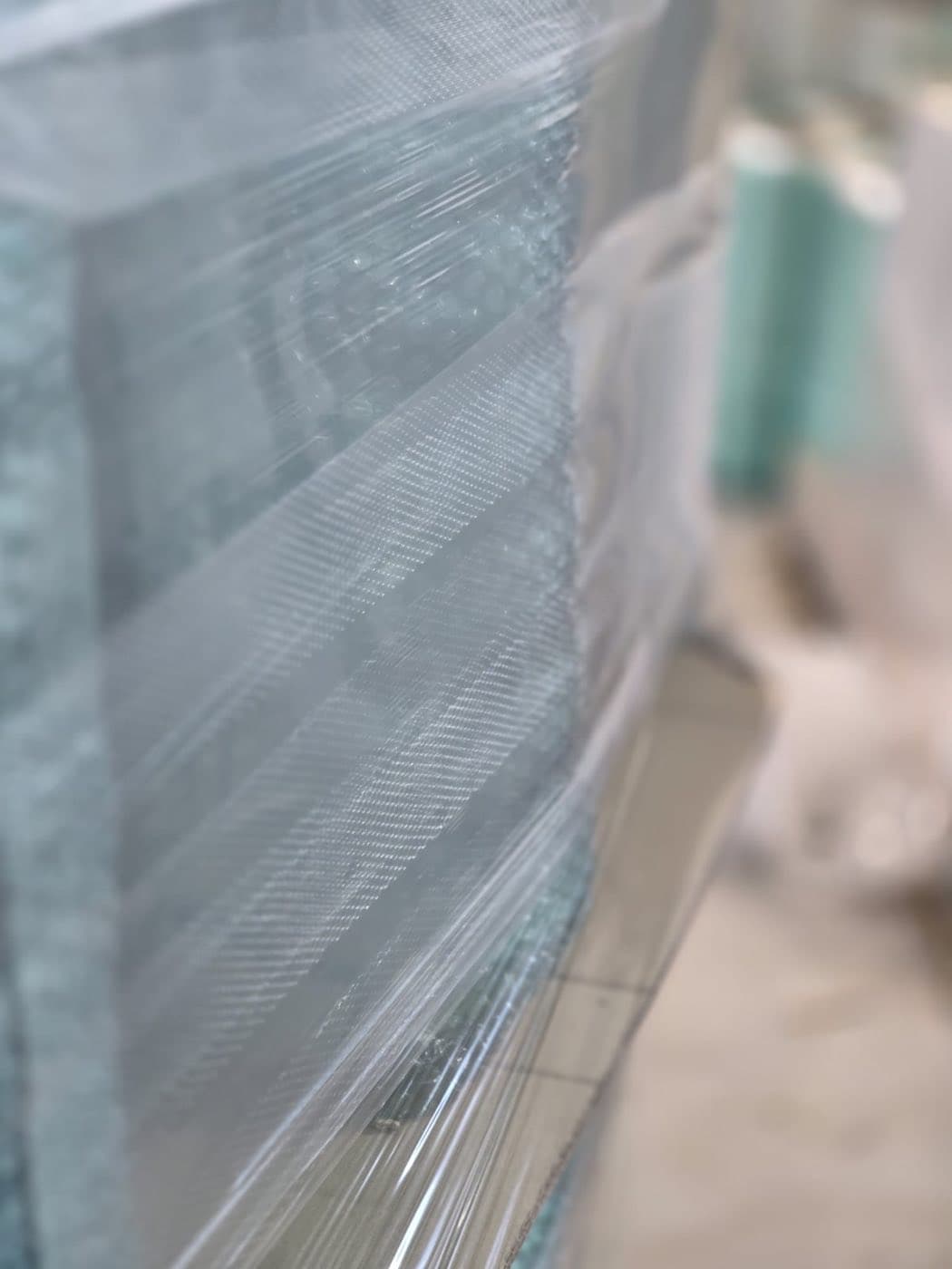 Glass panels wrapped in technical stretch film