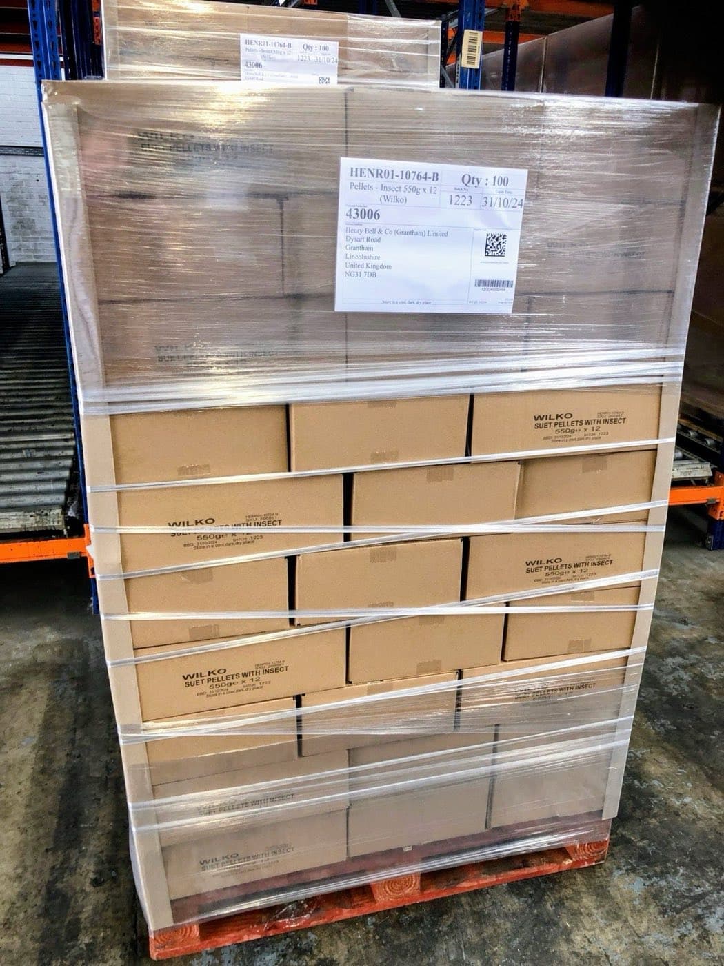 Wrapped pallet of cartons on the racking in a distribution warehouse