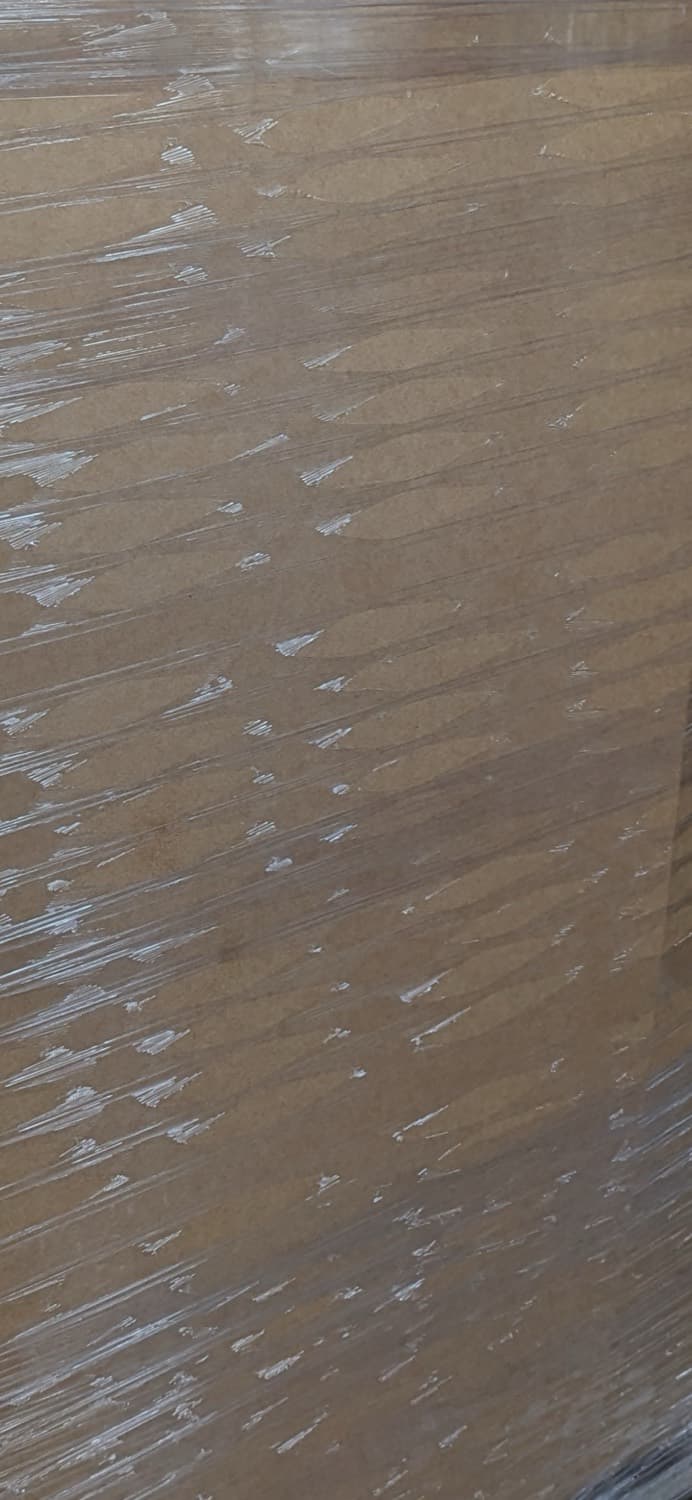 Close-up of the film surface stretched over a kraft carton