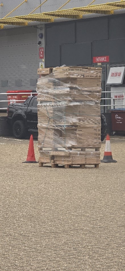 The same pallet rewrapped by hand with the Hyper Wrap System: the film sits tight and unbroken across the whole load