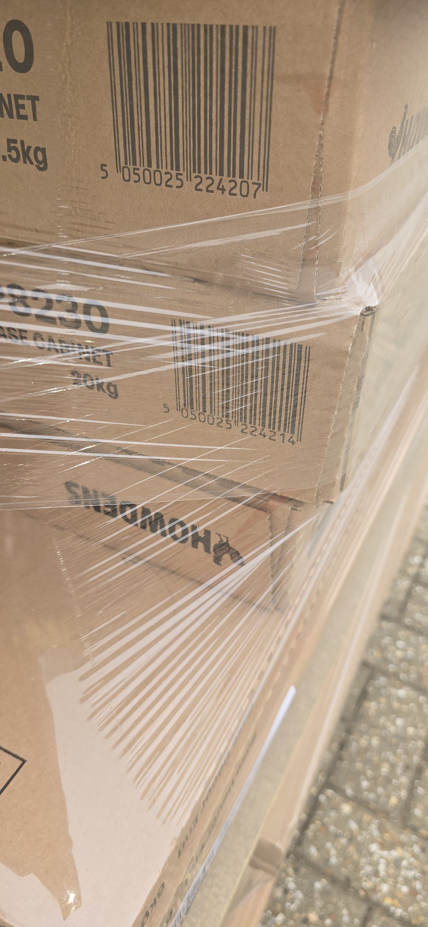 The film so evenly tensioned across the cartons that the barcodes underneath can still be scanned through it
