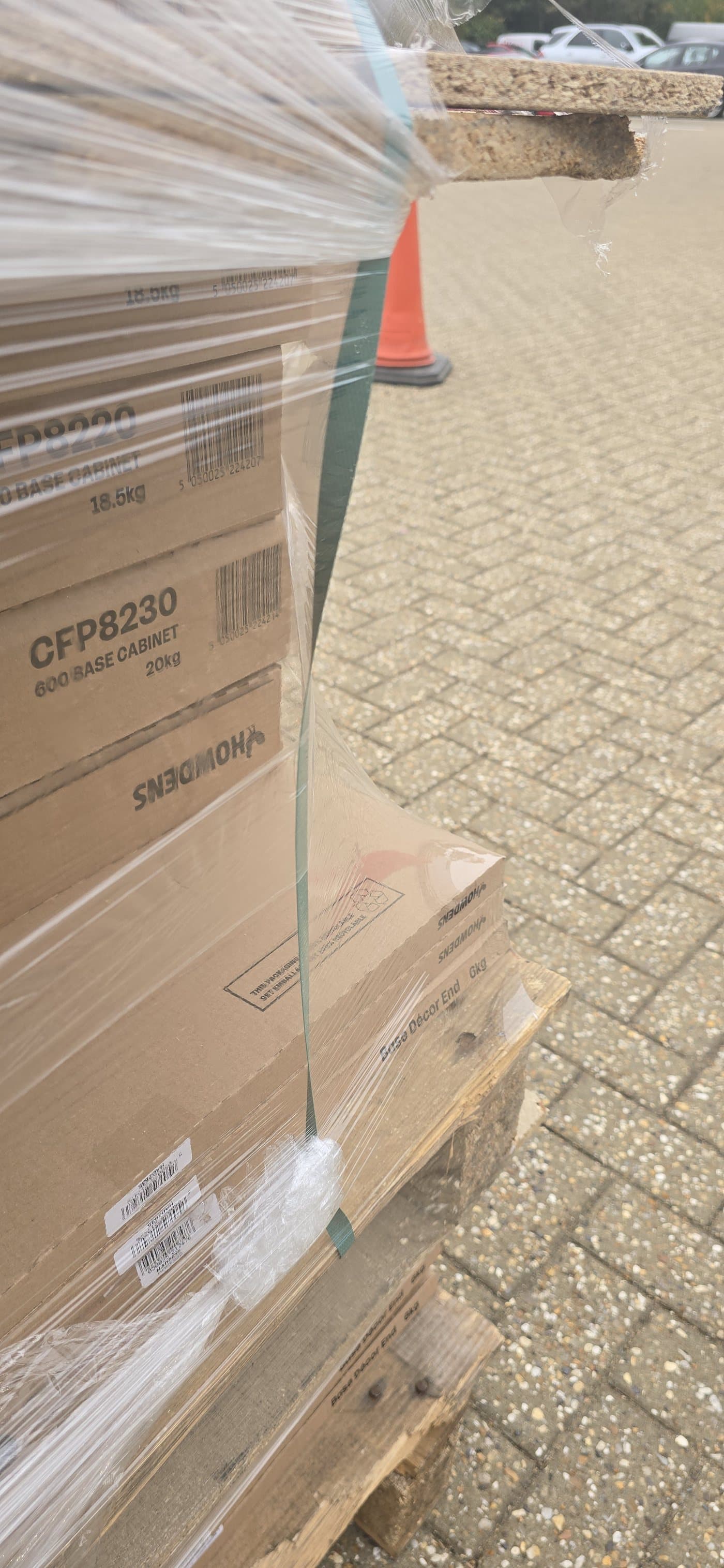 Hyper Wrap film pulled tight around the bottom corner of the load and down onto the pallet itself