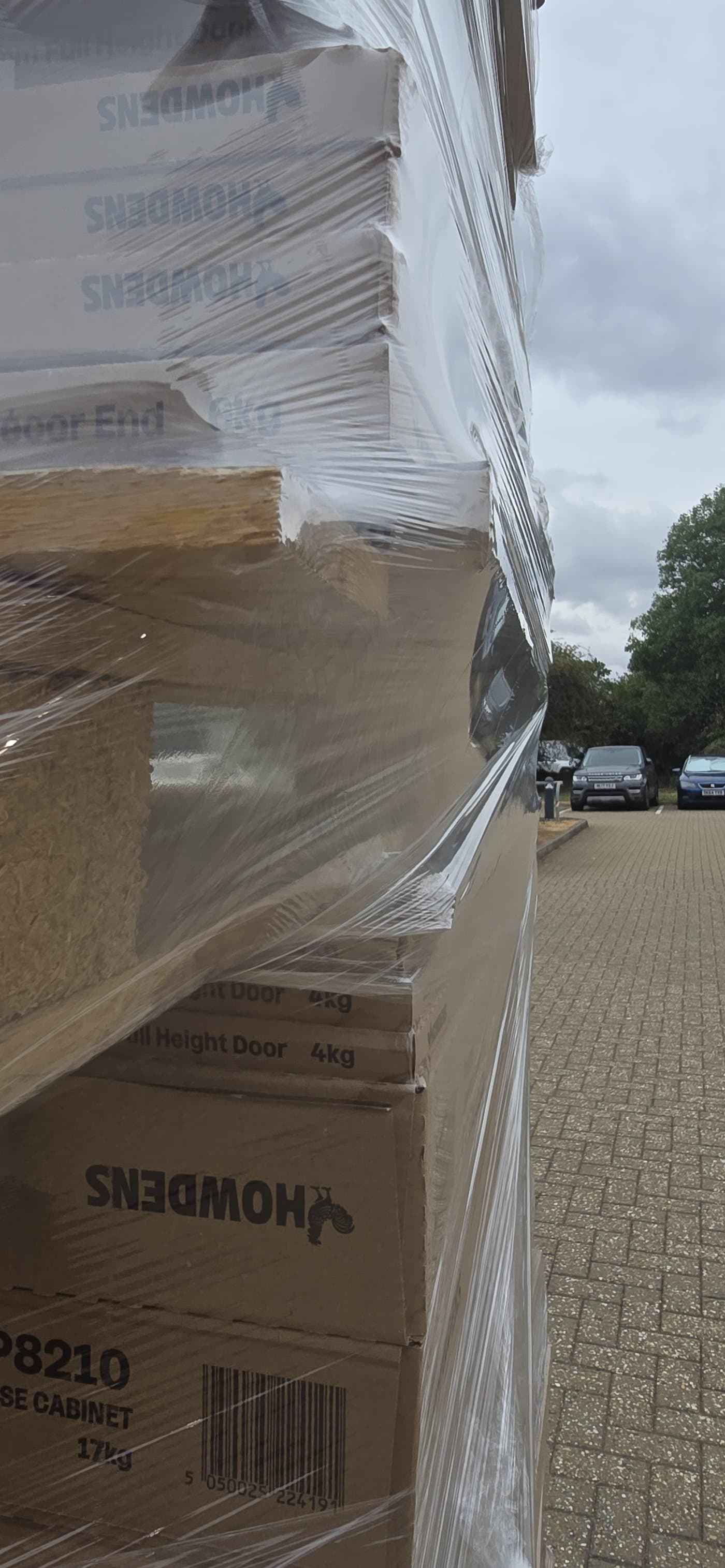 Film drawn over a length of timber standing proud of the load, taking the shape of it without splitting